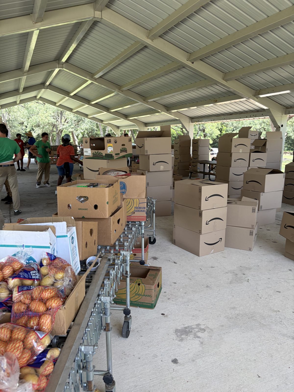 Boxes of food and school supplies ready for families at the PCS Outreach Ministries event